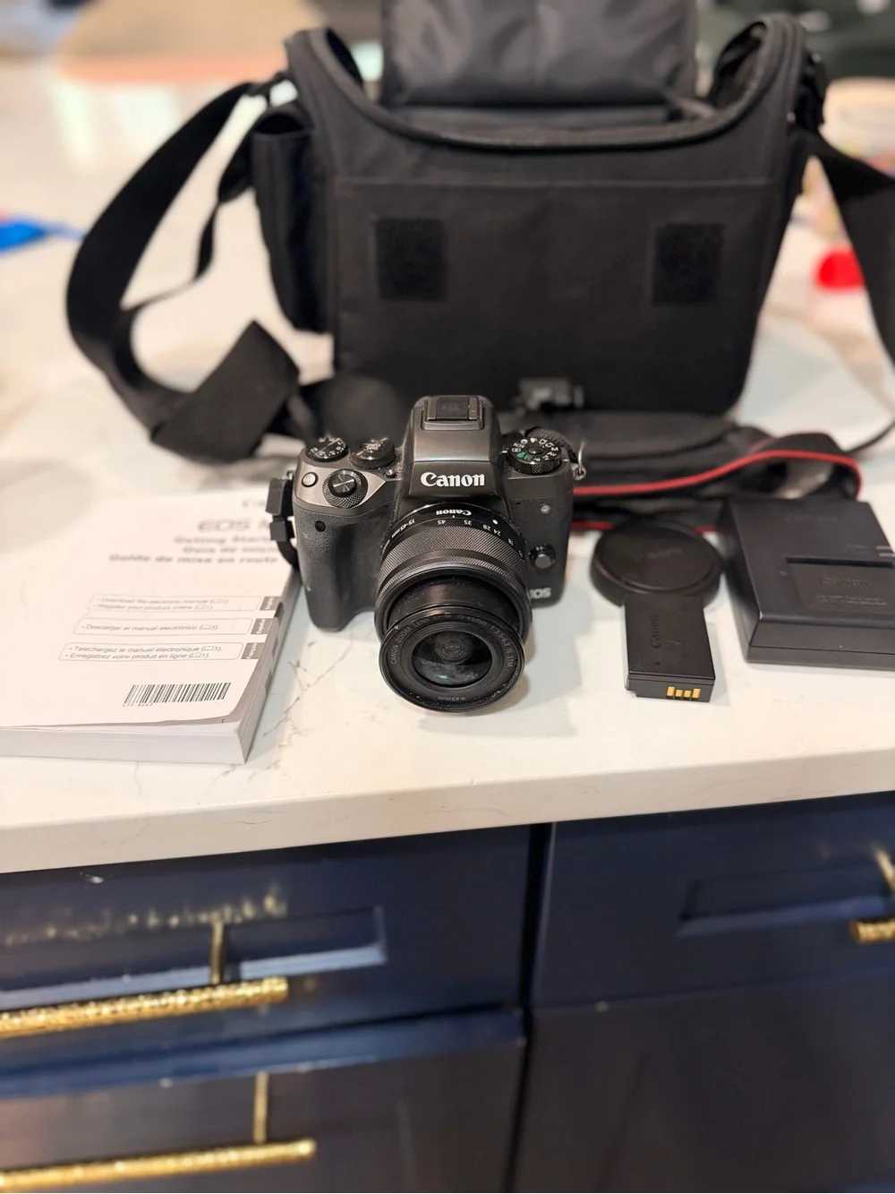 Canon Black Mirrorless Camera with Black Lens and Accessories